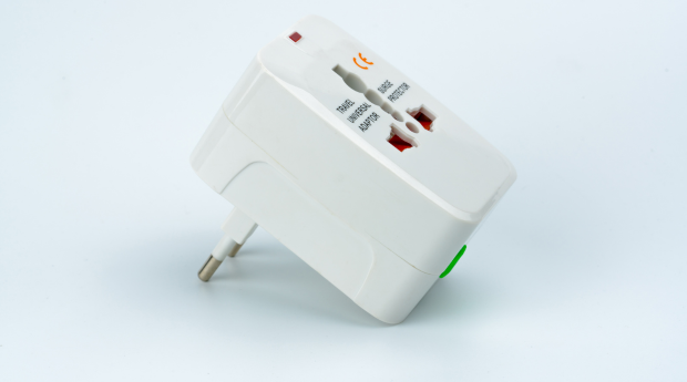 A white travel adaptor for EU sockets