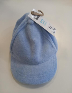 baby-cap Image shows a light blue cap facing down, with the tag attached at the top