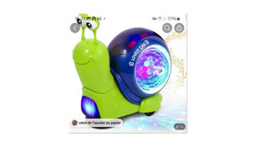 Interactive luminous snail toy sold on the TEMU platform Interactive Musical Light Up Crawling Snail Toy. The snail is bright green with a purple shell that lights up with multiple colours in the middle.