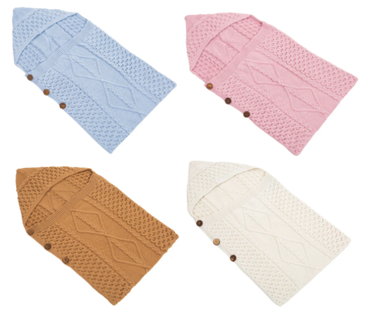 SAOL-Knitwear Images shows 4 sleeping nests for babies with aran knitting pattern and in 4 colours, blue, pink, brown and cream