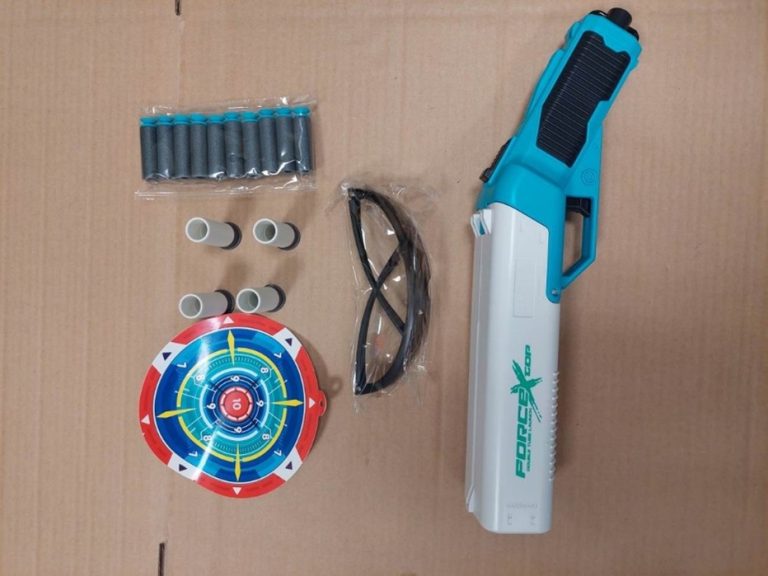 Soft-Bullet-Launcher-768x576 A plastic toy gun with soft toy bullets, a paper target and glasses