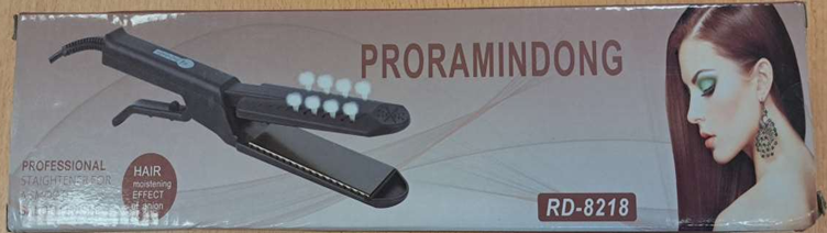 straightening-curling-Iron Packaging of a black straightening and curling iron.