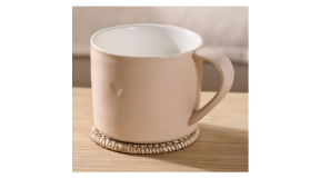 The White Company Burnham Heart Mug in Pink a pink porcelain mug with heart indent detail