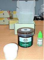 tototang-slime-2 A picture of the jar which contains the coffee slime. There are small boxes in the background of the image
