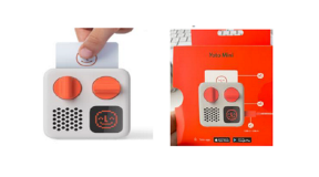 Yoto Mini 2021-2023 Edition Yoto branded mini speaker for children. The speaker is grey with with orange volume controls. The speaker is also pictured with its packaging.
